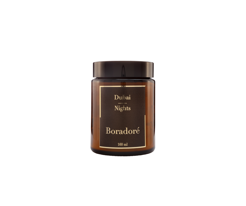 Boradoré Dubai Nights scented candle in amber glass jar on white background
