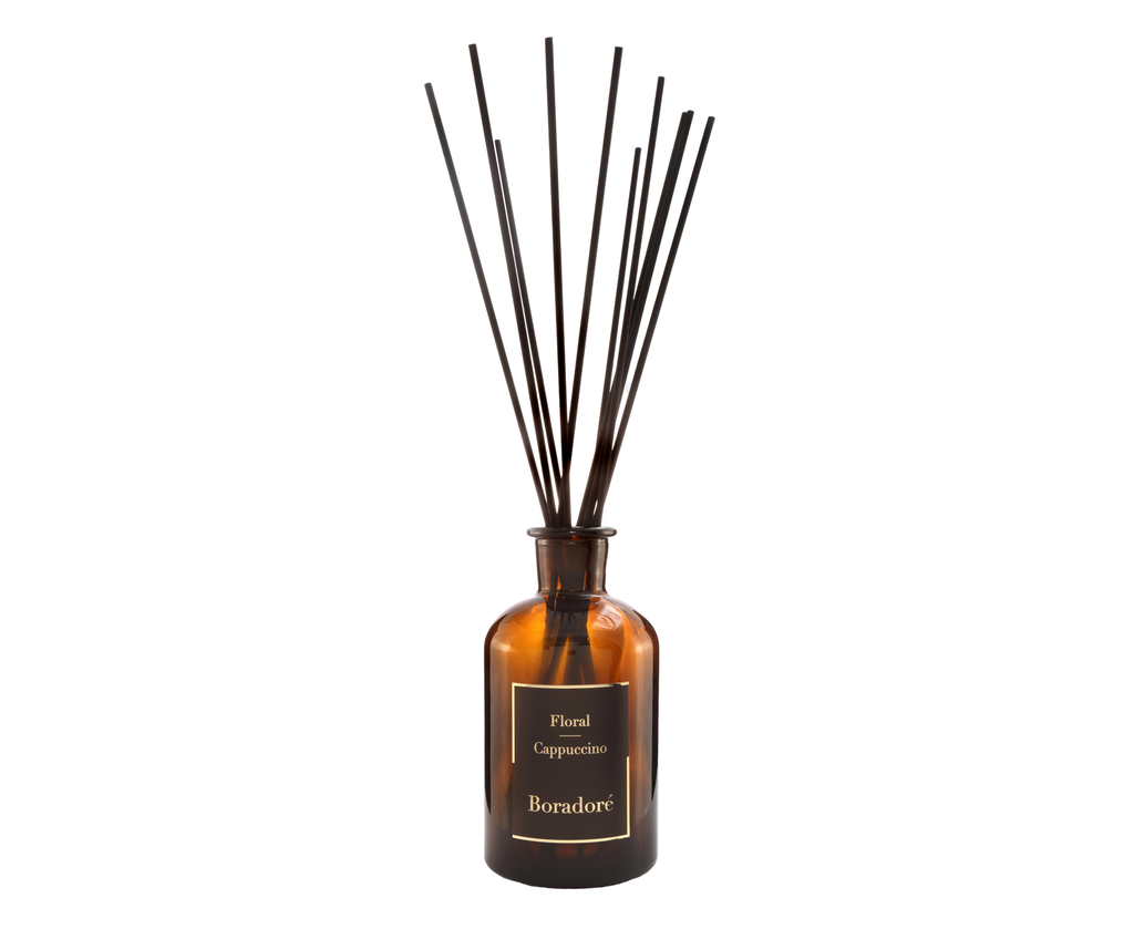 Boradoré Floral Cappuccino reed diffuser in amber glass bottle on white background
