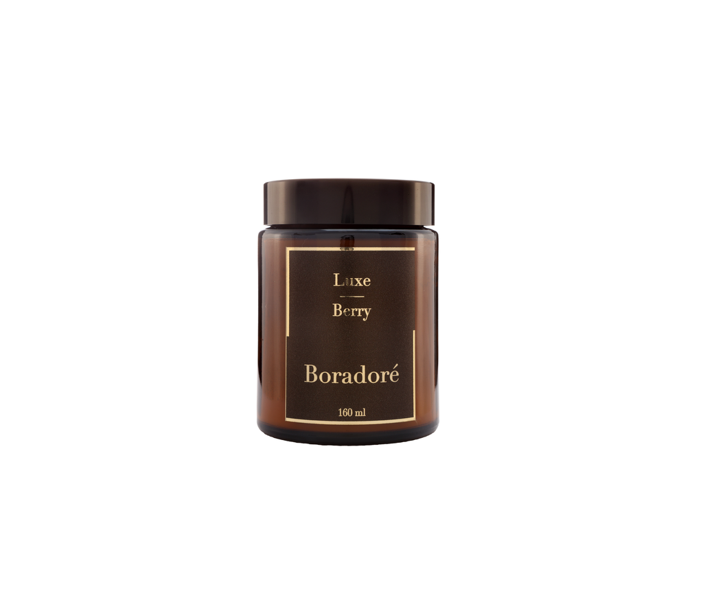 Boradoré Luxe Berry scented candle in amber glass jar on white background
